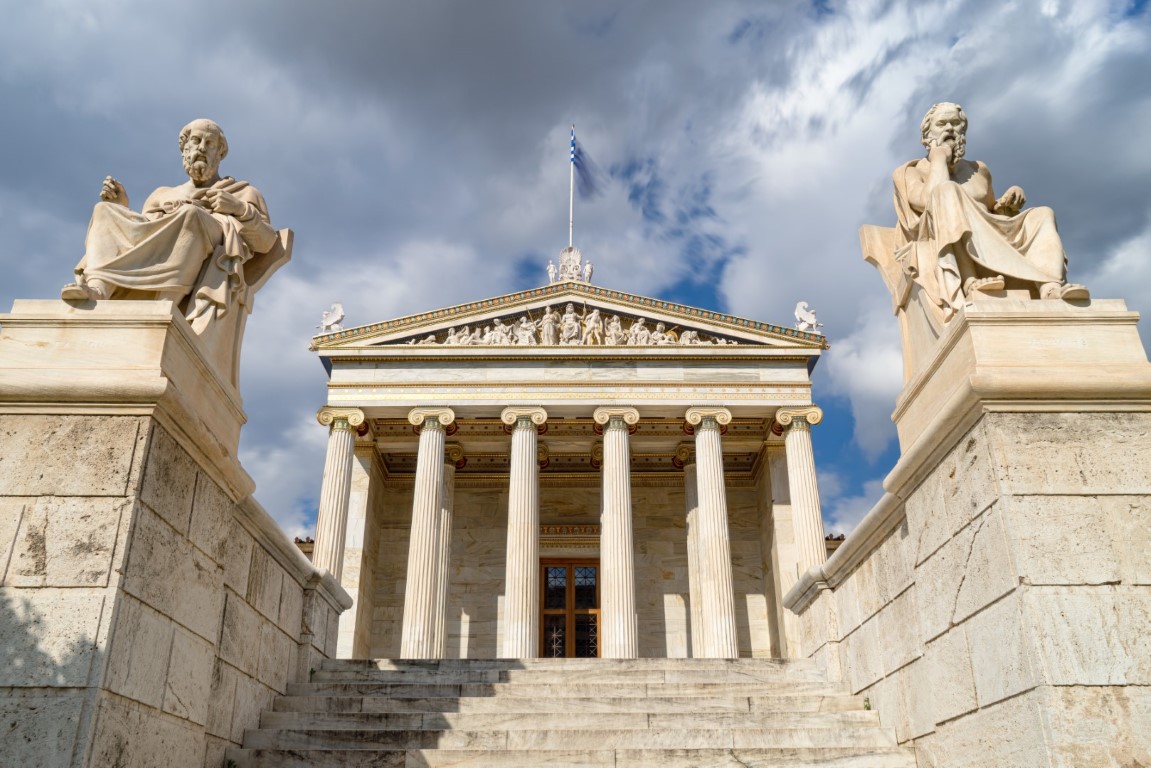 A low angle shot of the Academy of Athens in Greece